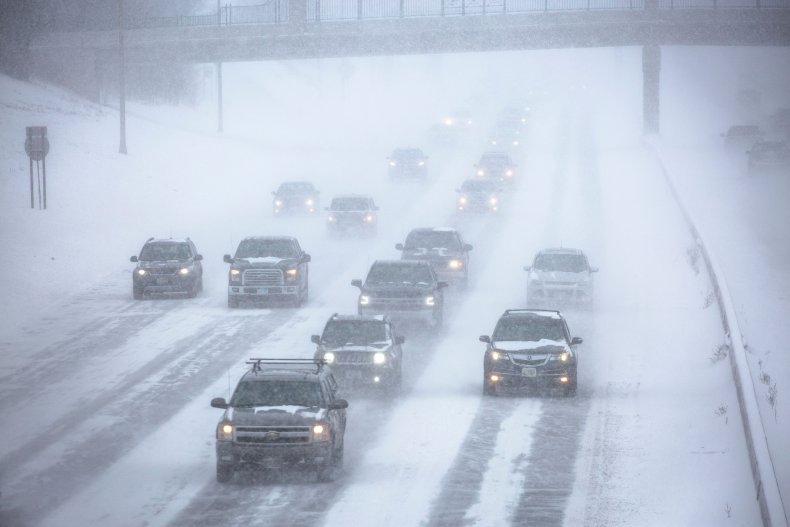 Cars drive through snow in Minnesota 