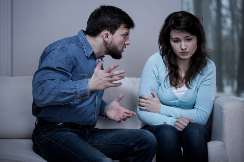 Angry man threatening his distressed girlfriend
