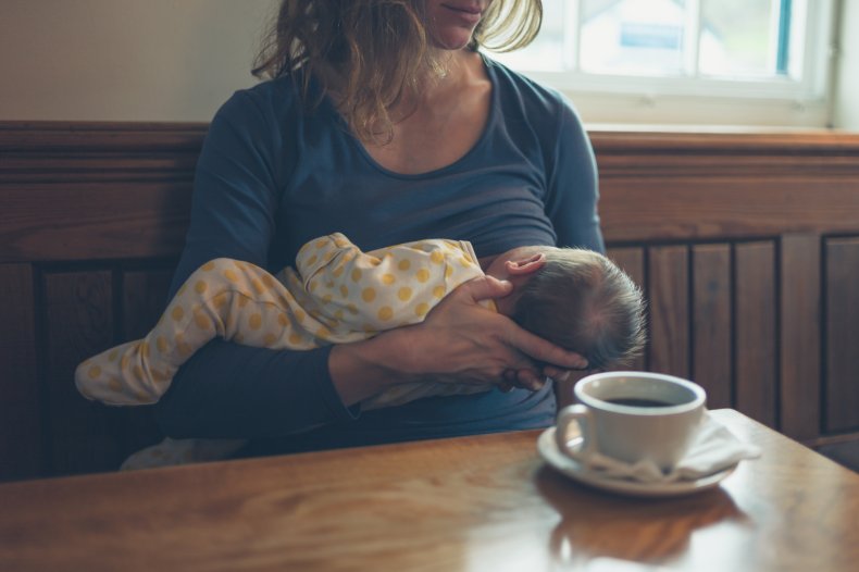 Mom breastfeeding her baby at a cafe