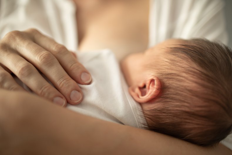 A mom breastfeeding her baby.