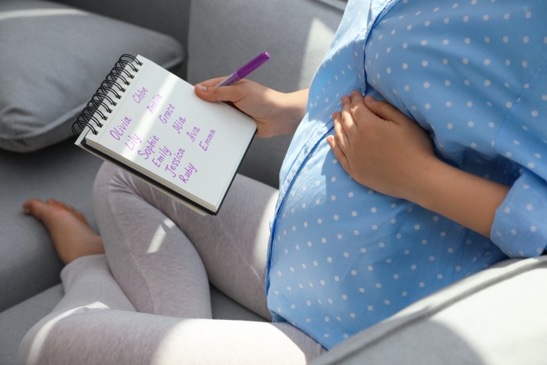Pregnant woman with a list of names