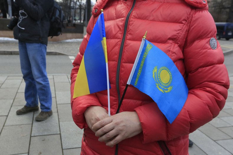 Ukraine Kazakhstan flags at protest in Almaty
