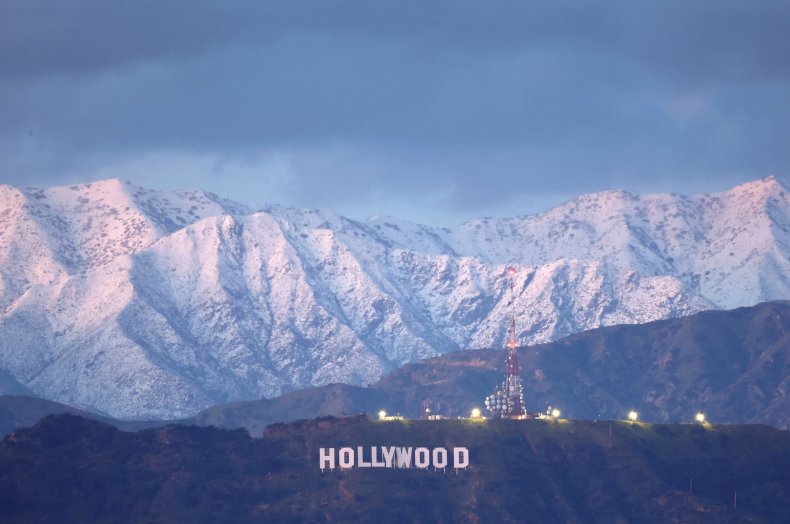 Hollywood sign in front of snowy mountains