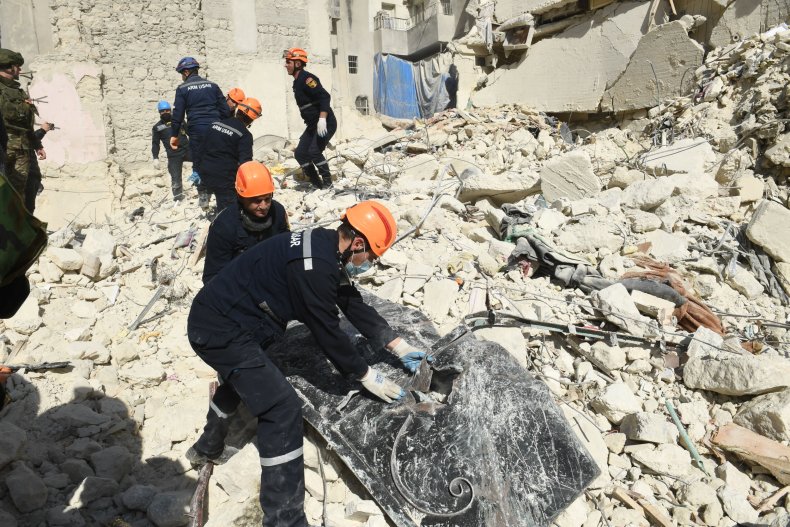 Armenian rescuers sift through rubble 