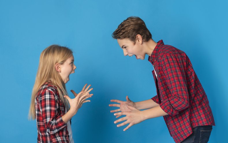 Young girl and older boy shouting. 