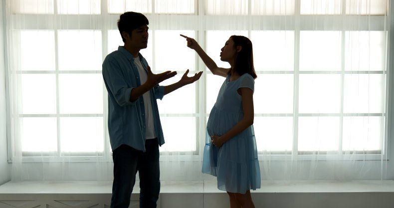 Man and his pregnant wife arguing