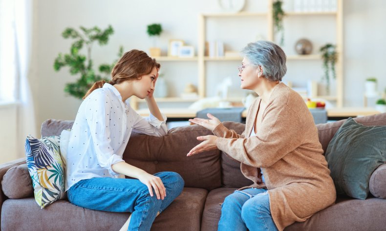 Older woman pleading with frustrated adult daughter