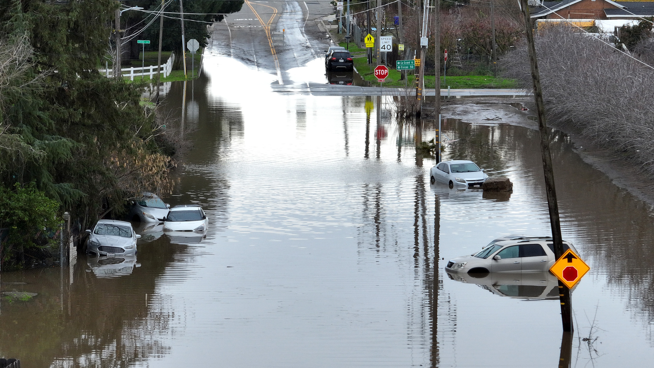 cars stranded flooded street