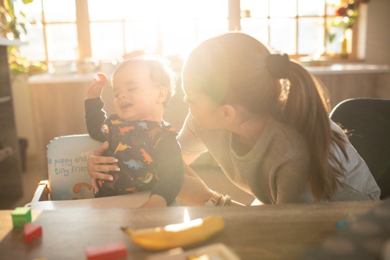 Pre-teen trying to put infant in highchair