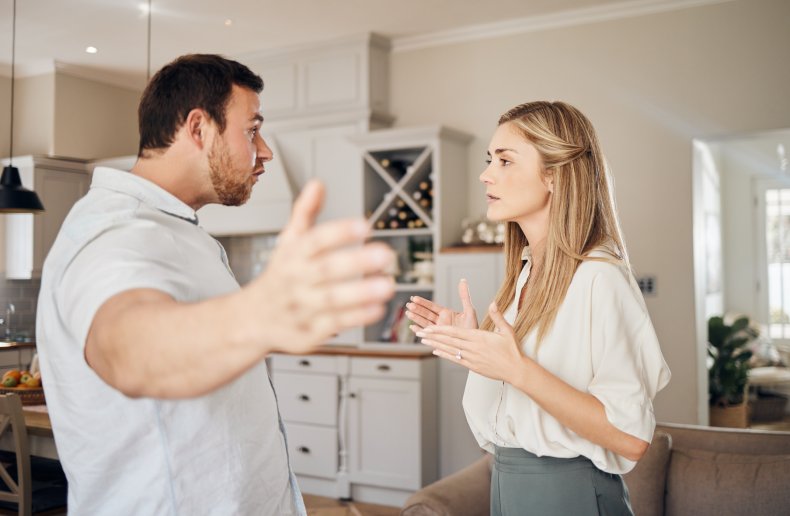 Man and woman arguing in a kitchen