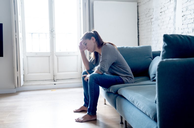 Frustrated woman sitting on a sofa