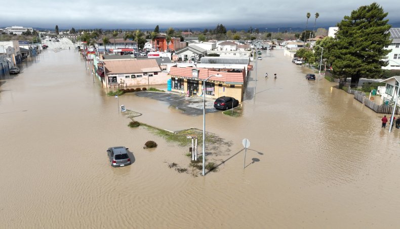 Homes and cars submerged in floodwaters