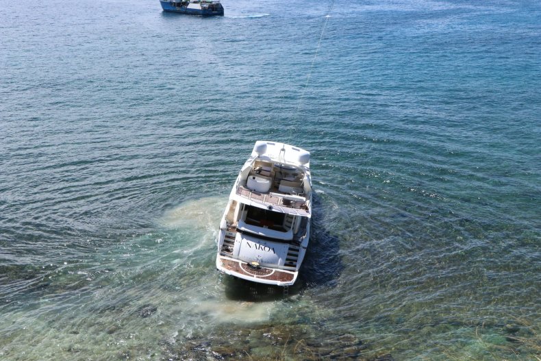 Yacht being towed away