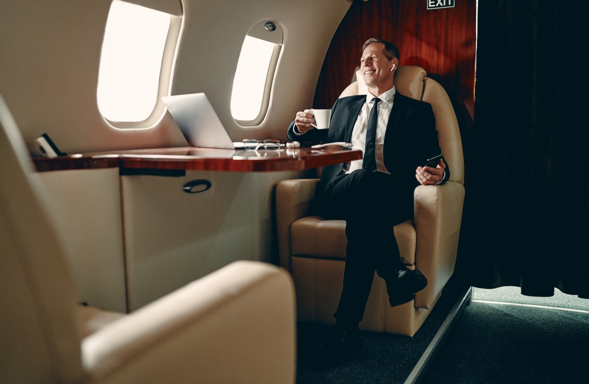 Man sitting in private jet. 