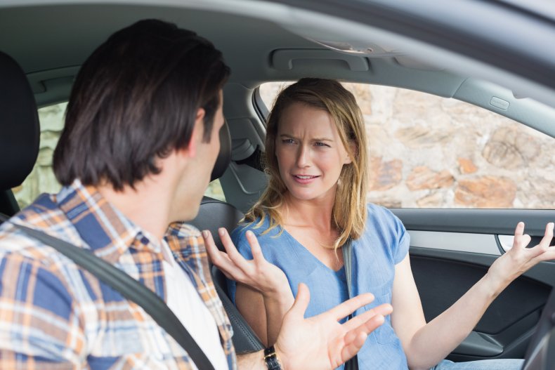 Man and woman arguing in a car