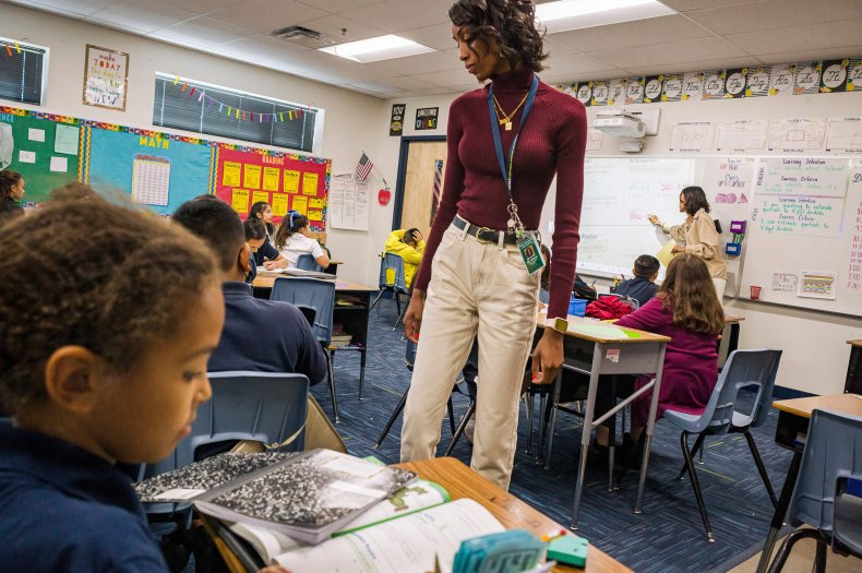 Aisha Thomas (purple shirt) is studying to become a teacher