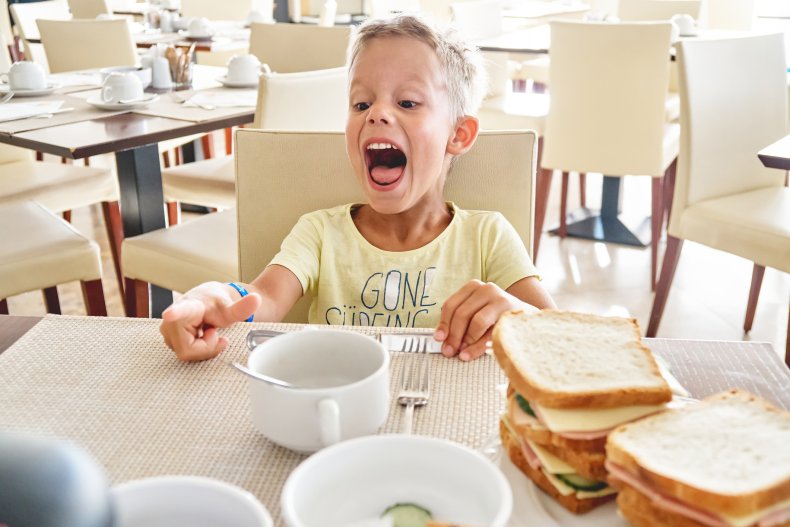 Copper chafing dish boy screaming at table in a restaurant