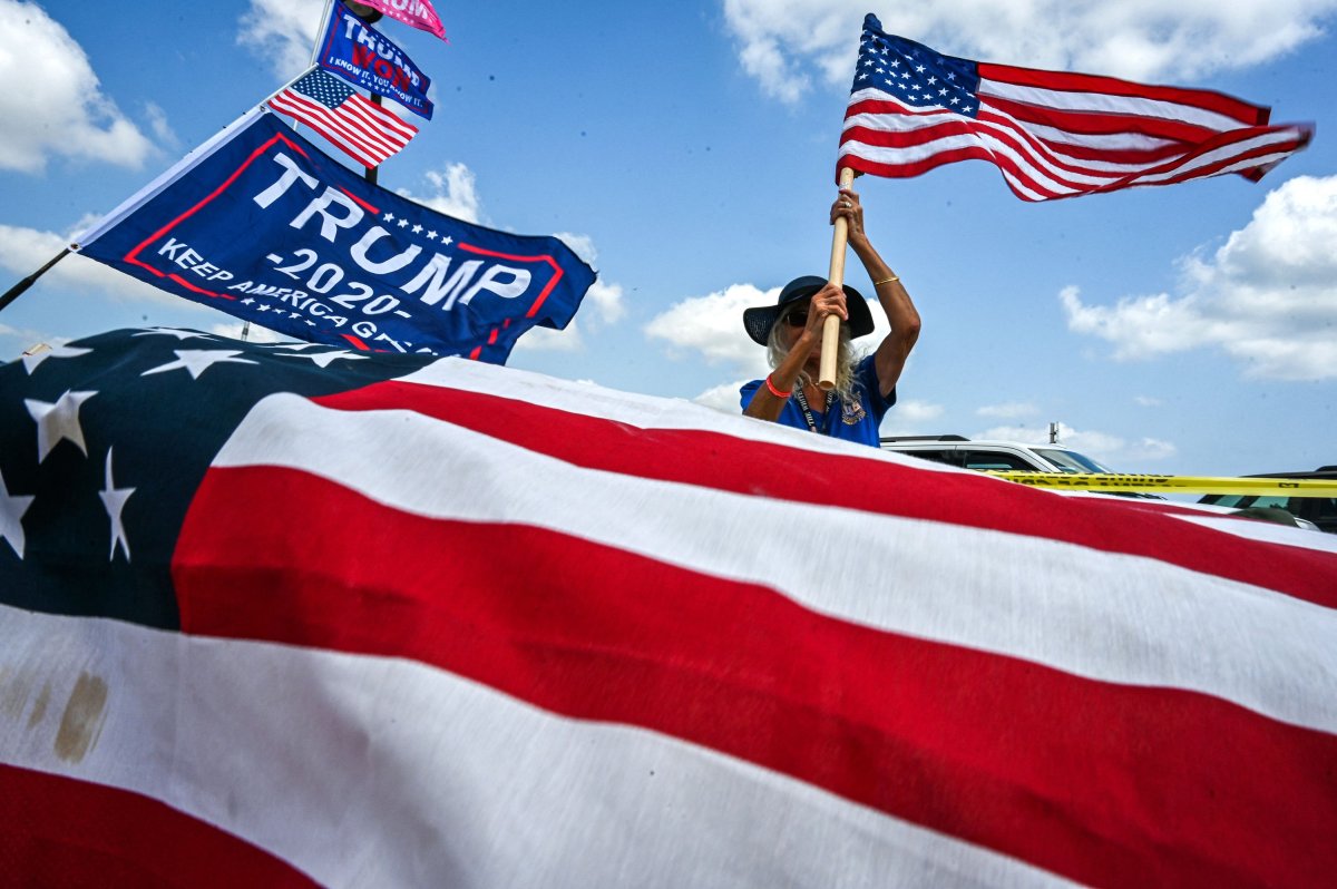 Trump supporter holding US flag