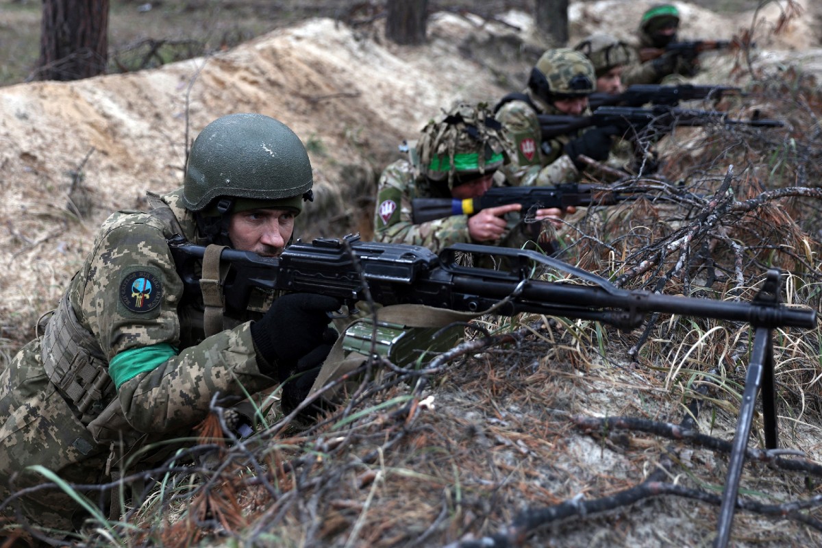 Grenade Detonates as Russian Troops Huddle Together, Video Shows