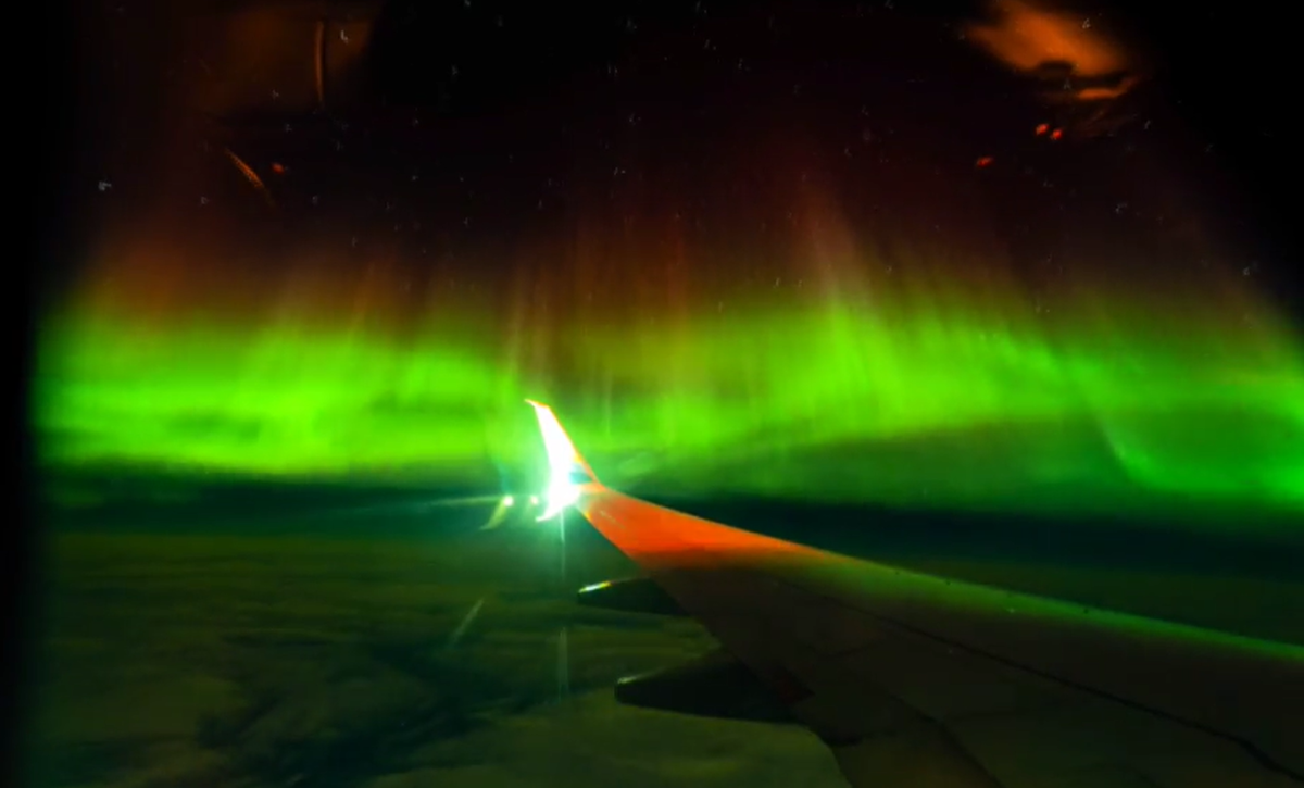 Aurora borealis from airplane window