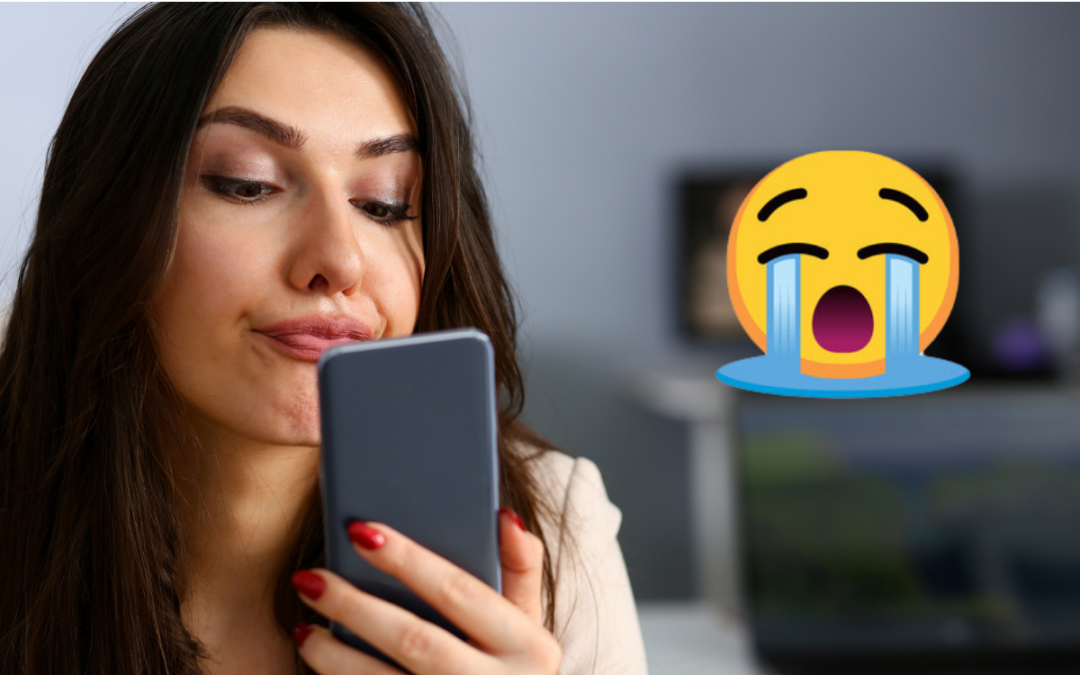 A woman, a phone and an emoji.
