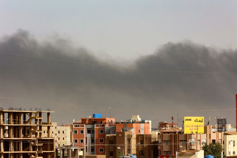 Smoke rises above residential buildings in Khartoum