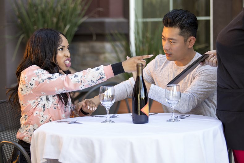 Woman yelling at waiter in a restaurant