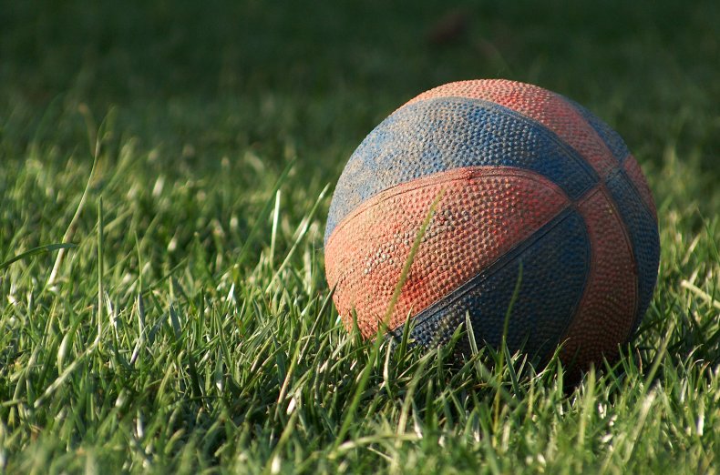 Child shot retrieving ball from neighbor's yard
