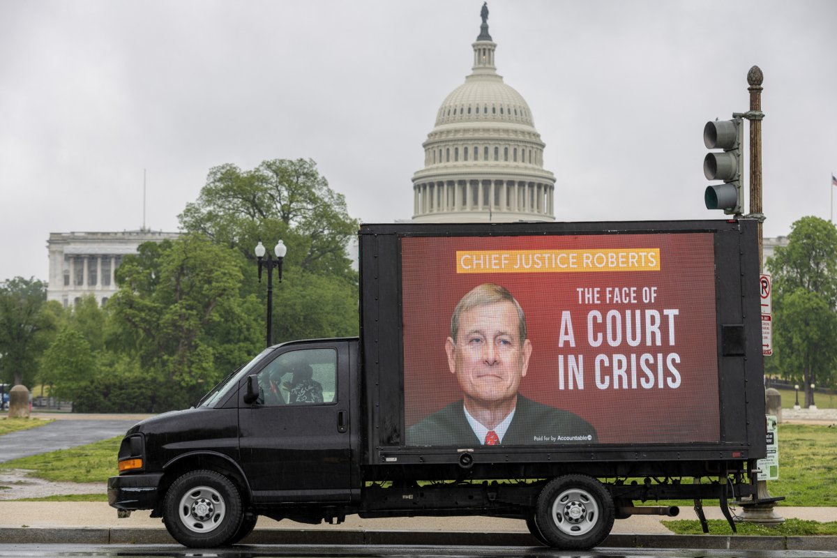 A mobile billboard showing John Roberts 