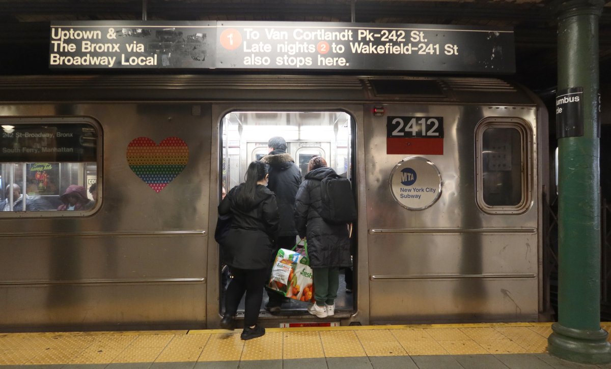 People board a "1" line subway train 