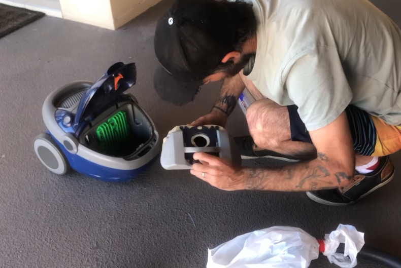 Removing snake from vacuum cleaner