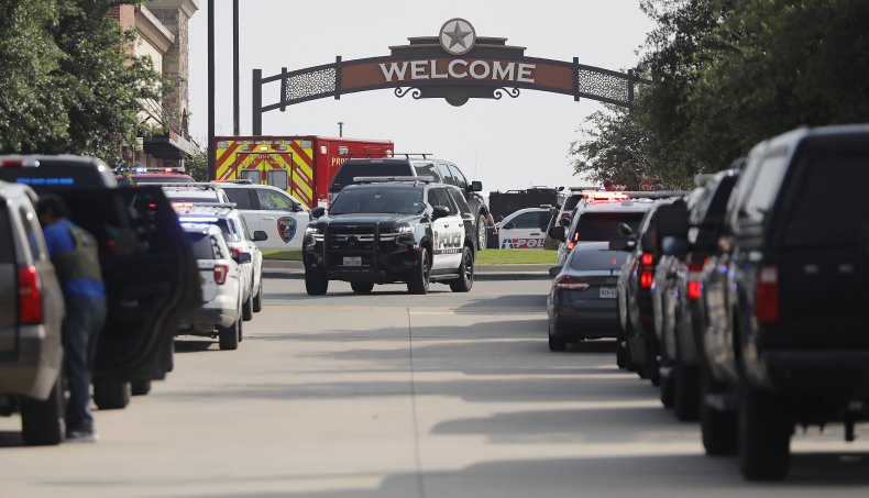  Emergency vehicles line the entrance 