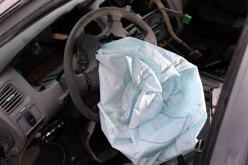 Deployed airbag in car