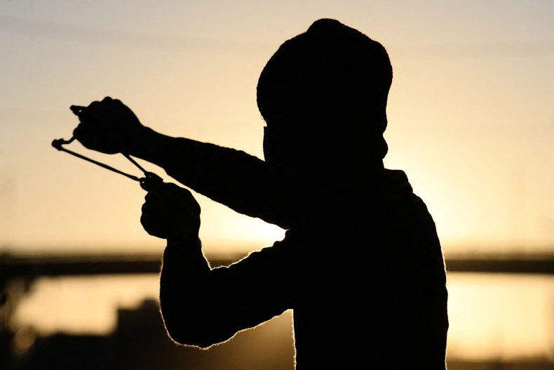 boy with slingshot