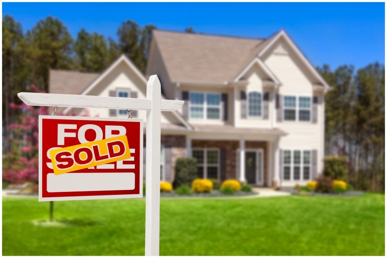 a house with a sold sign outside