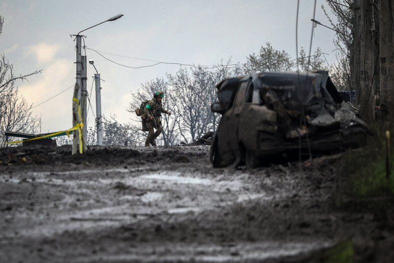 Ukraine soldier runs for cover in Bakhmut