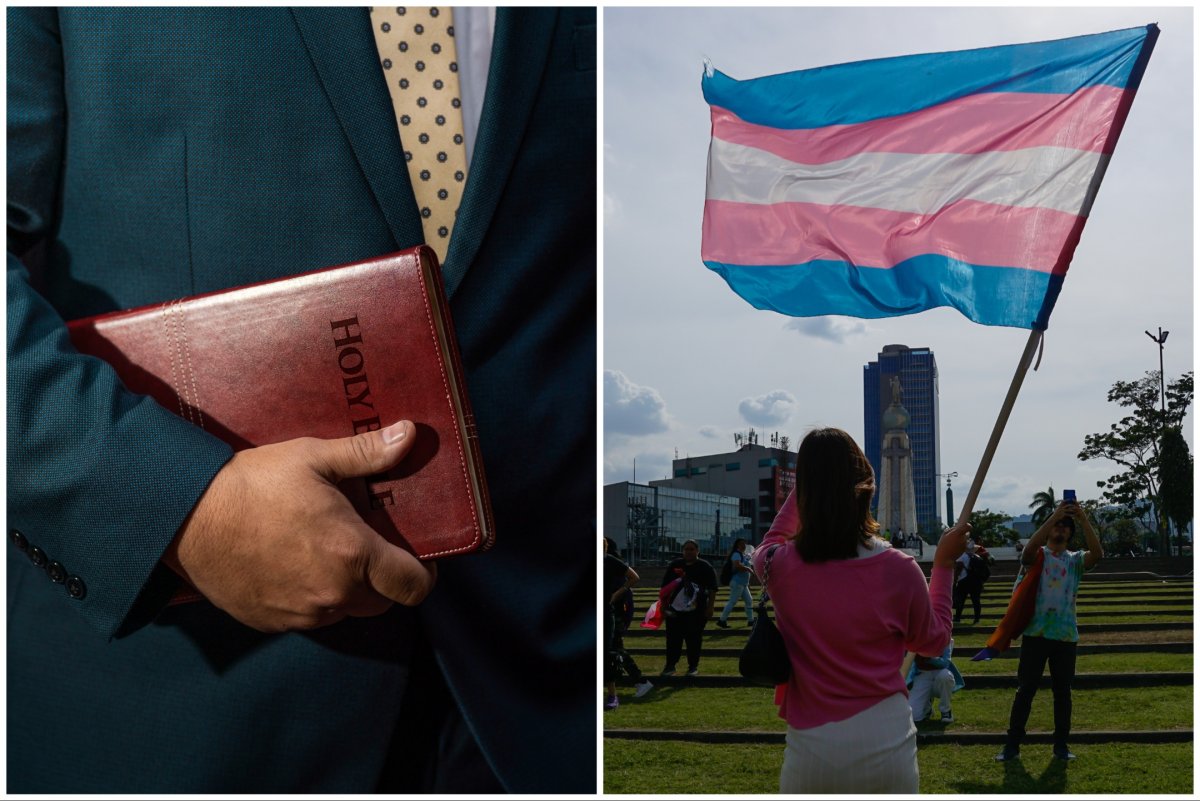 man holding Bible and a transgender flag