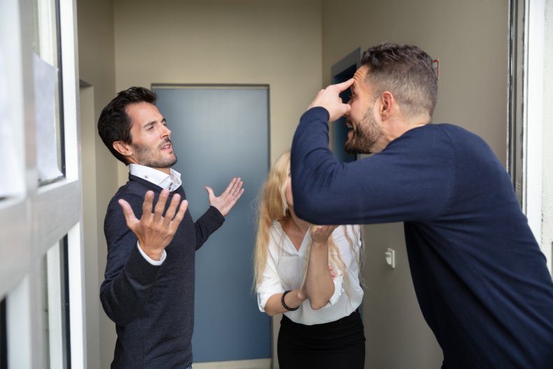Three neighbors arguing in a hallway
