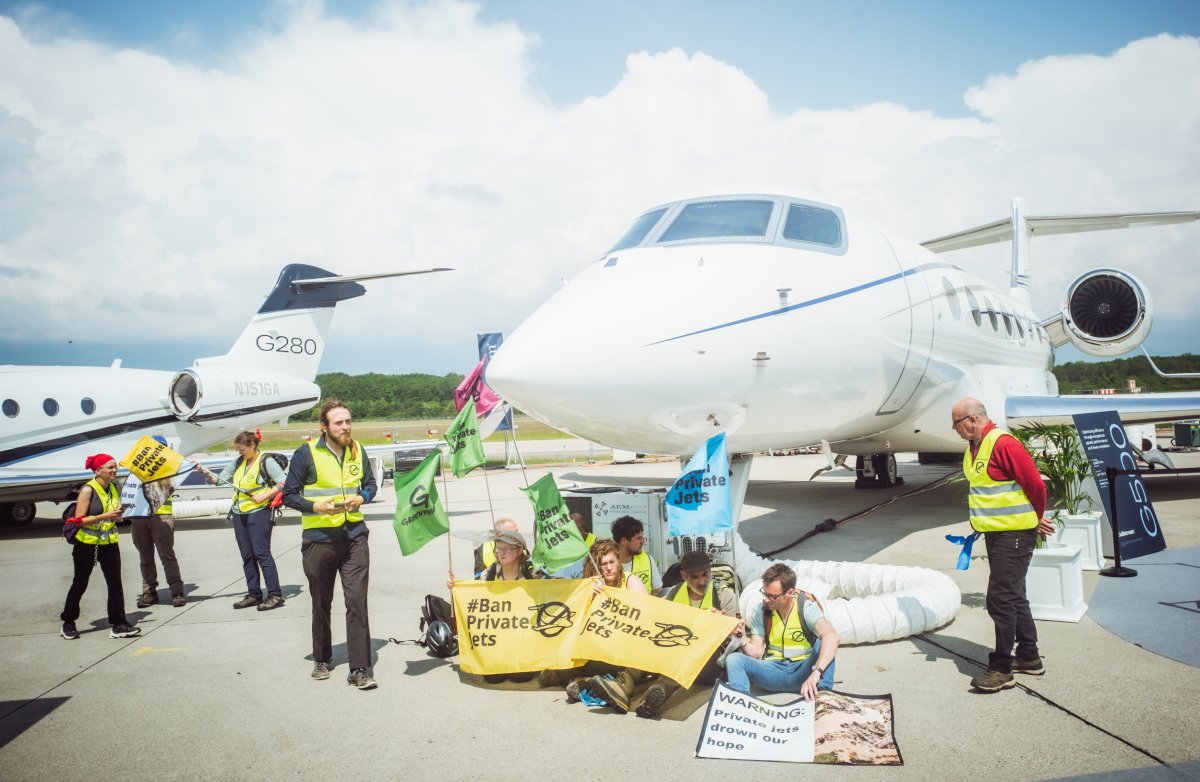 Activists disrupt private jet exhibition