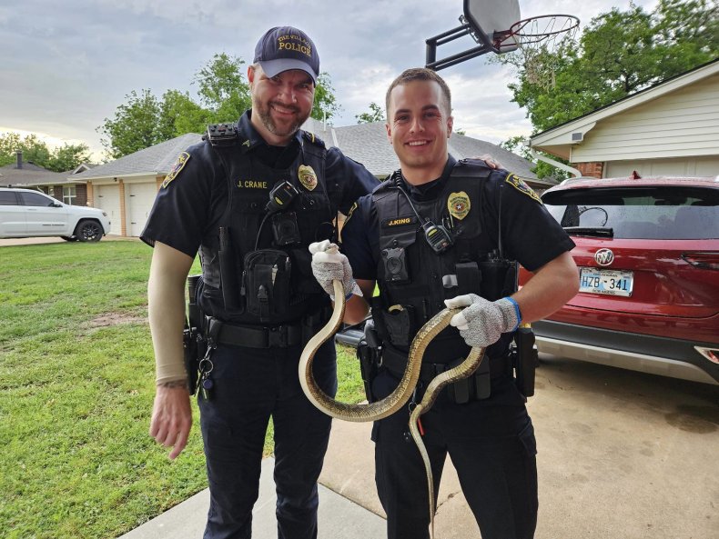 Officers with rat snake 