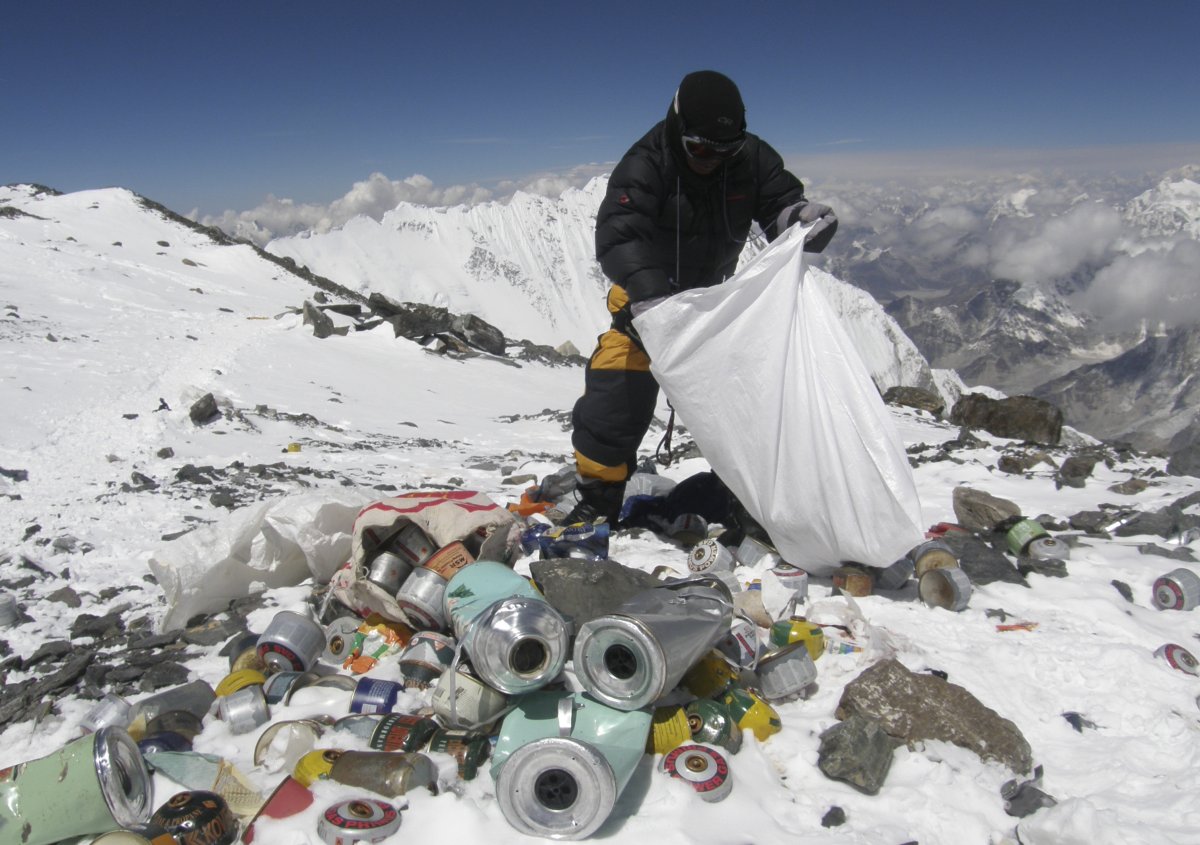 Nepalese sherpa collecting garbage on Mount Everest.