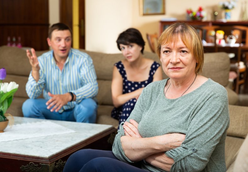 Older woman ignoring her son and daughter-in-law