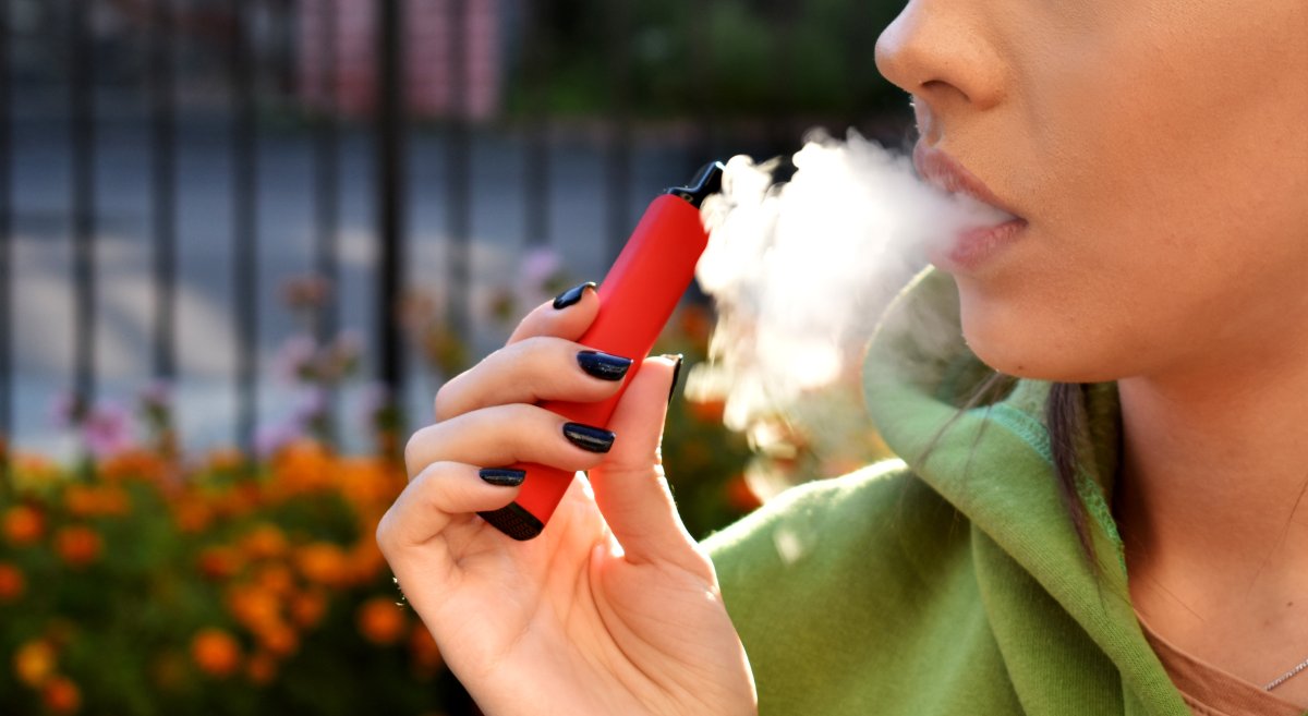 A young woman vaping