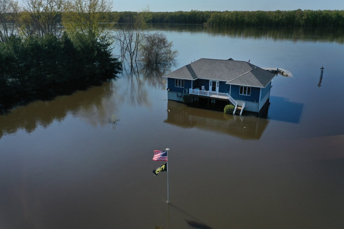 A home is surrounded by floodwater 