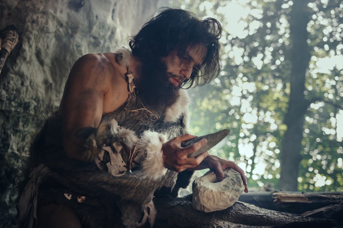 A Neanderthal using a stone tool