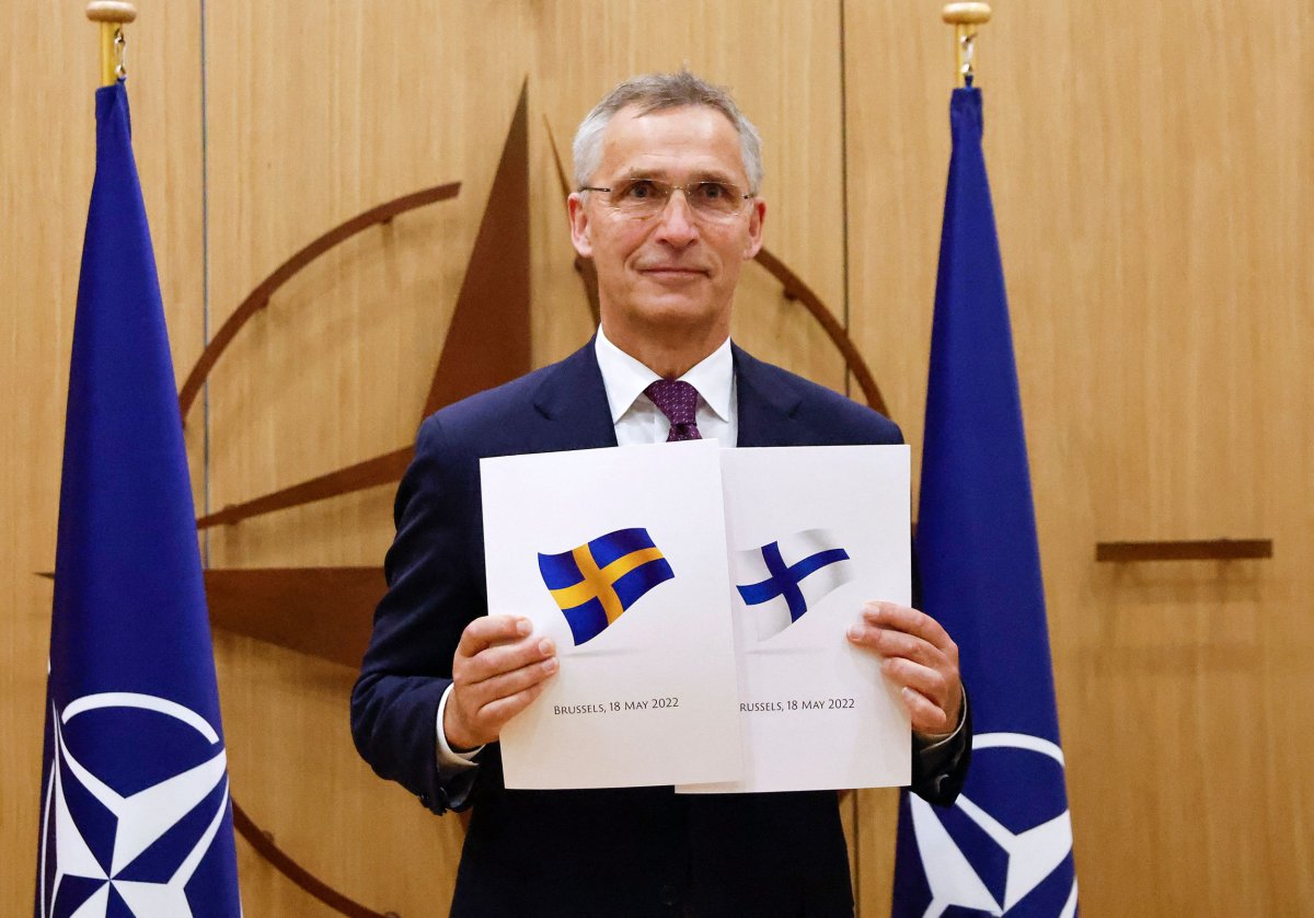 Jens Stoltenberg poses in Brussels May 2022