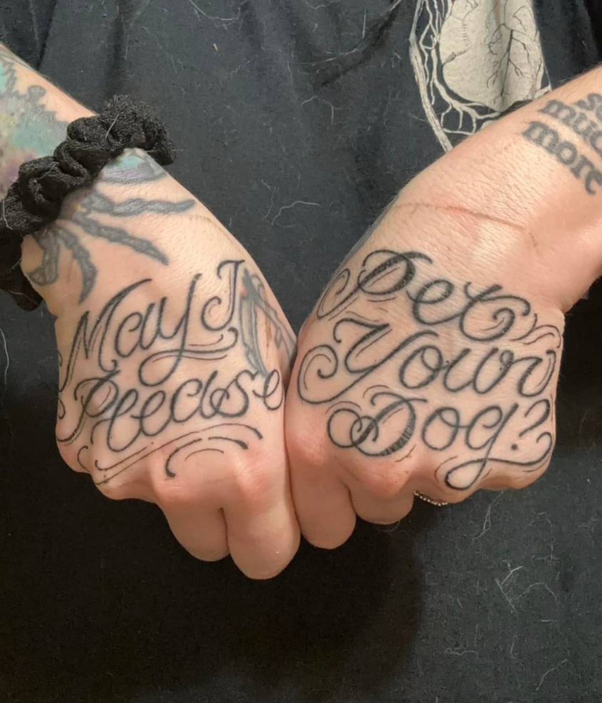 Mae Doll's tattooed hands