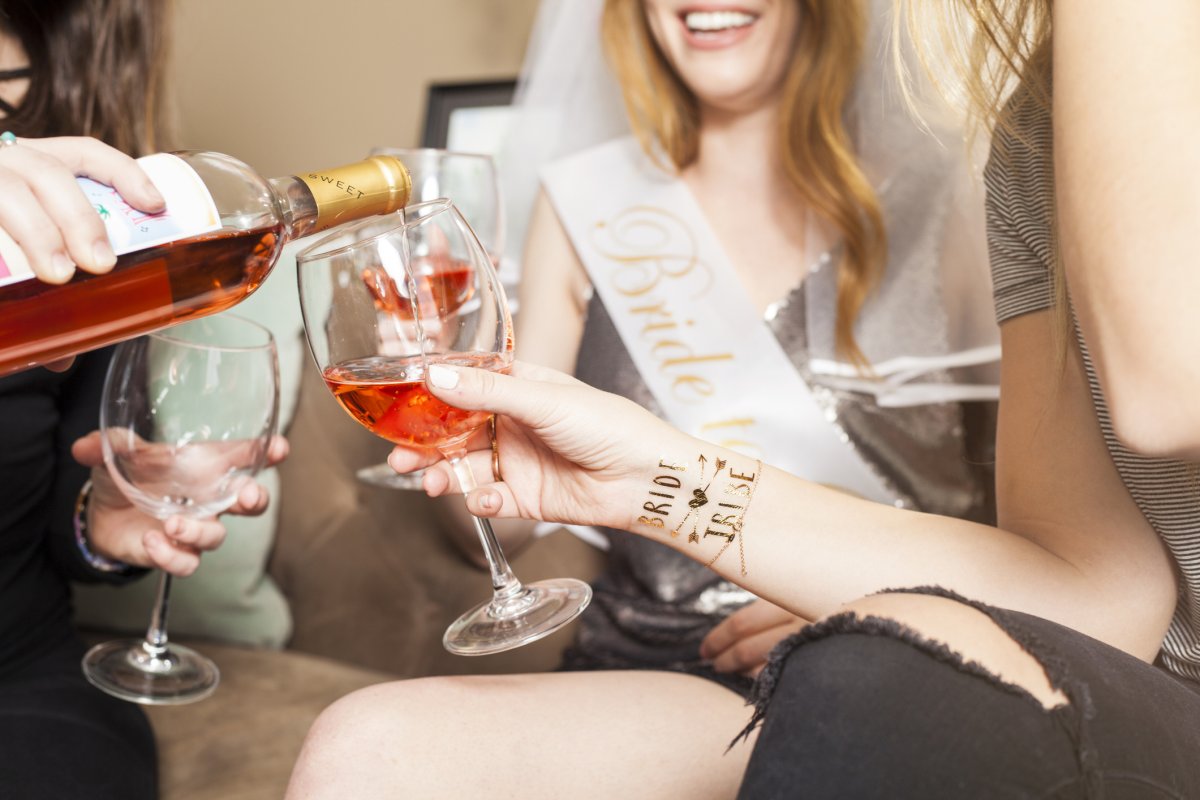 Bachelorette party guests toasting with wine