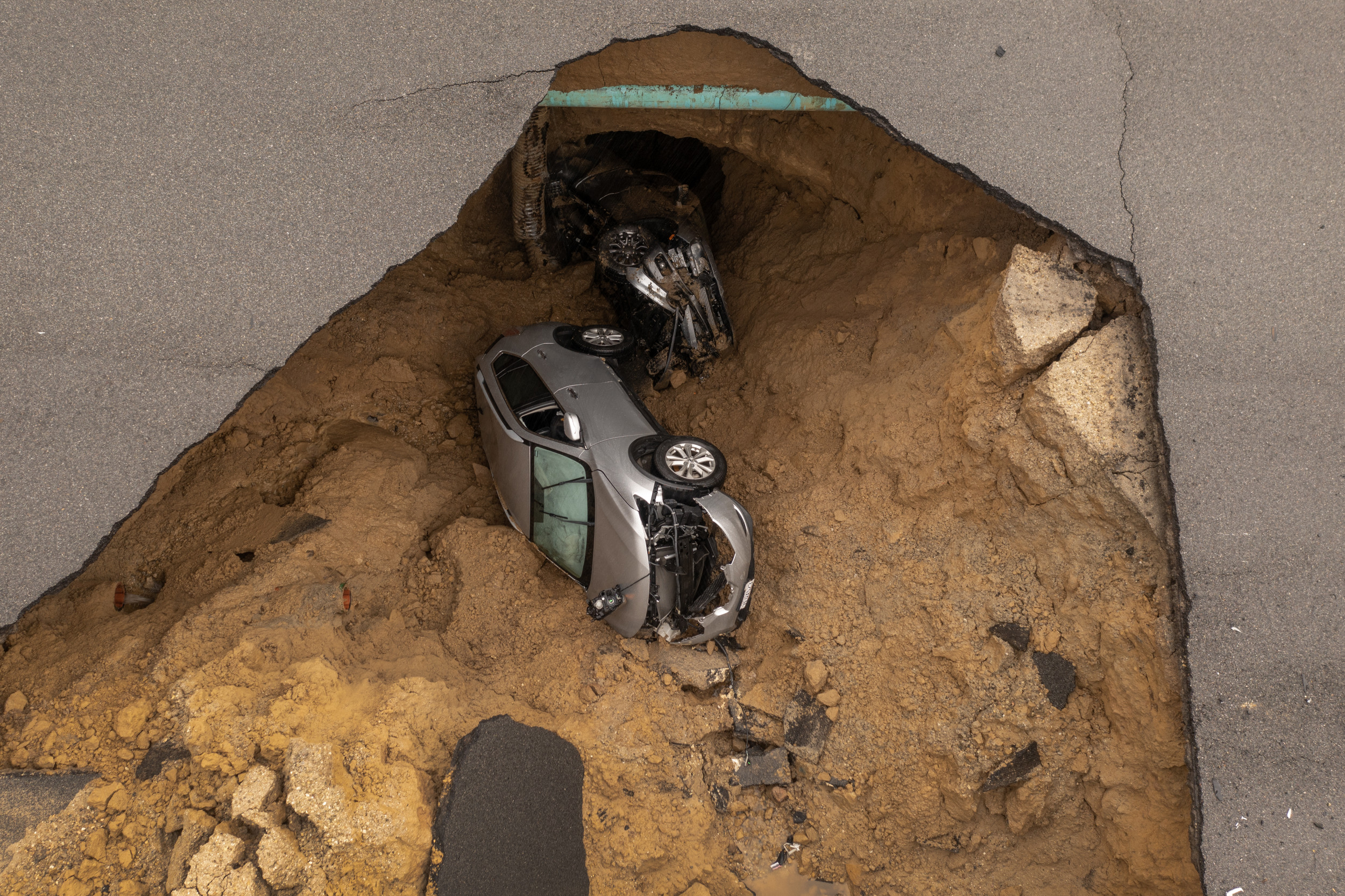 Huge Sinkhole Swallows Car In The Middle Of The Night