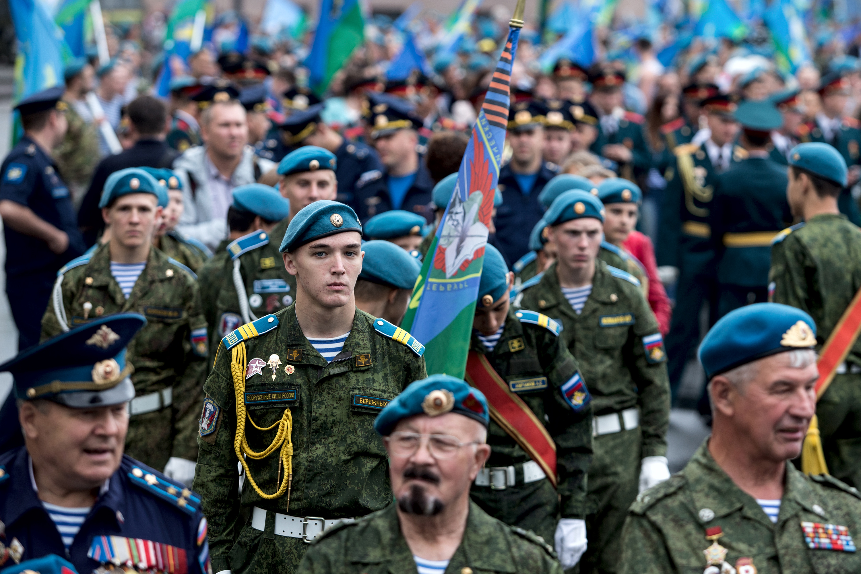 Paratrooper Carries Table in His Mouth During Military Celebration